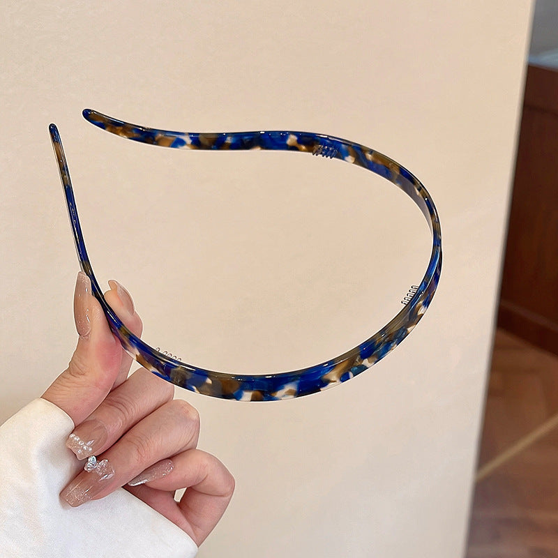"Stilrent unisex acetatpannband för glasögon, böjt design, perfekt för dag och natt. Accessoar för kvinnor, bekvämt, elegant.