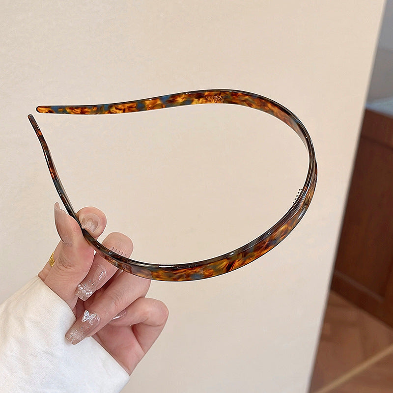 "Stilrent unisex acetatpannband för glasögon, böjt design, perfekt för dag och natt. Accessoar för kvinnor, bekvämt, elegant.