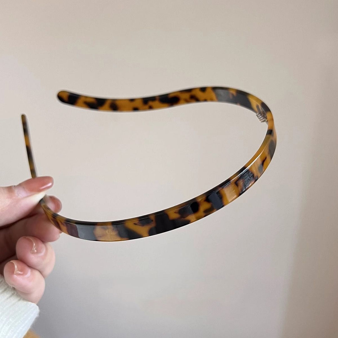 "Stilrent unisex acetatpannband för glasögon, böjt design, perfekt för dag och natt. Accessoar för kvinnor, bekvämt, elegant.