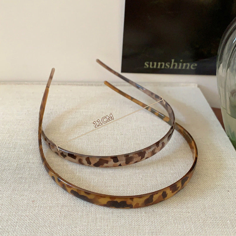 "Stilrent unisex acetatpannband för glasögon, böjt design, perfekt för dag och natt. Accessoar för kvinnor, bekvämt, elegant.