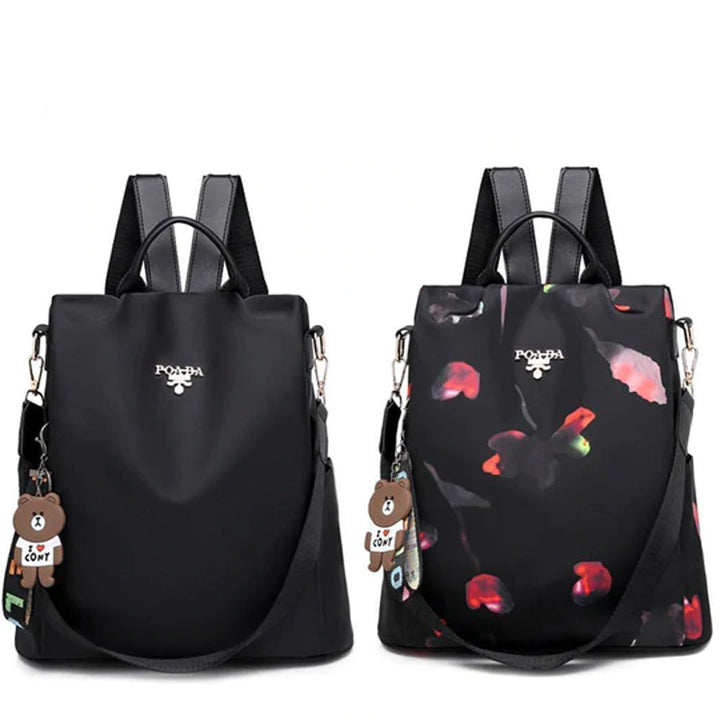 "Stöldsäker damryggsäck med fjärilsmönster, stor kapacitet, Oxford- och polyestertyg, mångsidiga fickor, justerbara remmar."