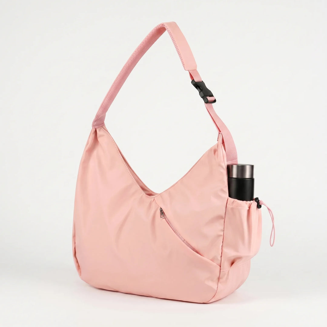 Praktisk damväska för fitness med yogamatteremmar, finns i både rosa och elegant svart design.