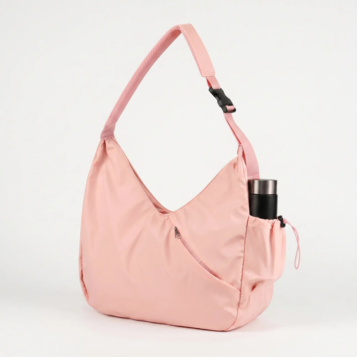 Praktisk damväska för fitness med yogamatteremmar, finns i både rosa och elegant svart design.