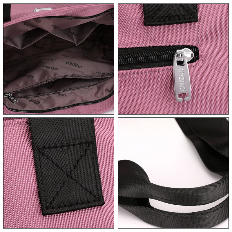 "Stor nylon damväska med flera fickor och dragkedja, svart färg, rymlig design, handtag 27 cm."