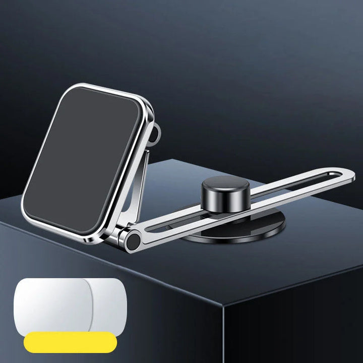 Supermagnetisk biltelefonhållare i silver, rund design, med kraftfullt grepp för säker navigering och enkel justering.