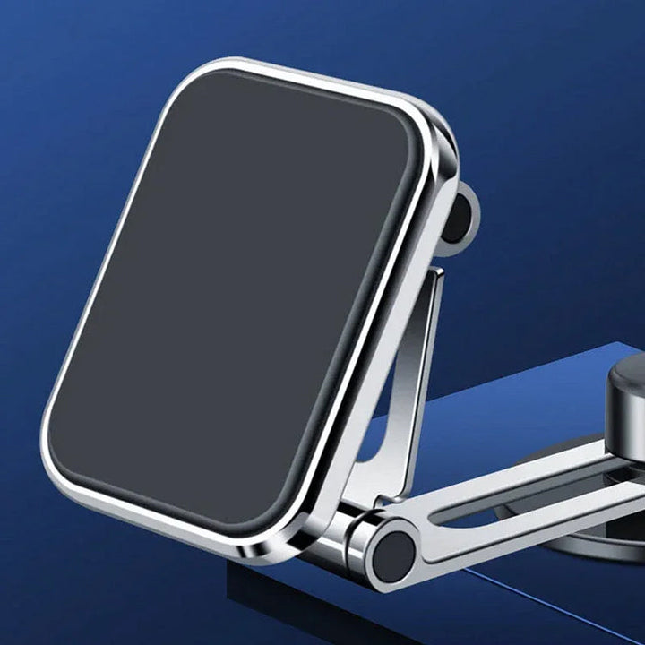 Supermagnetisk biltelefonhållare i silver, rund design, med kraftfullt grepp för säker navigering och enkel justering.