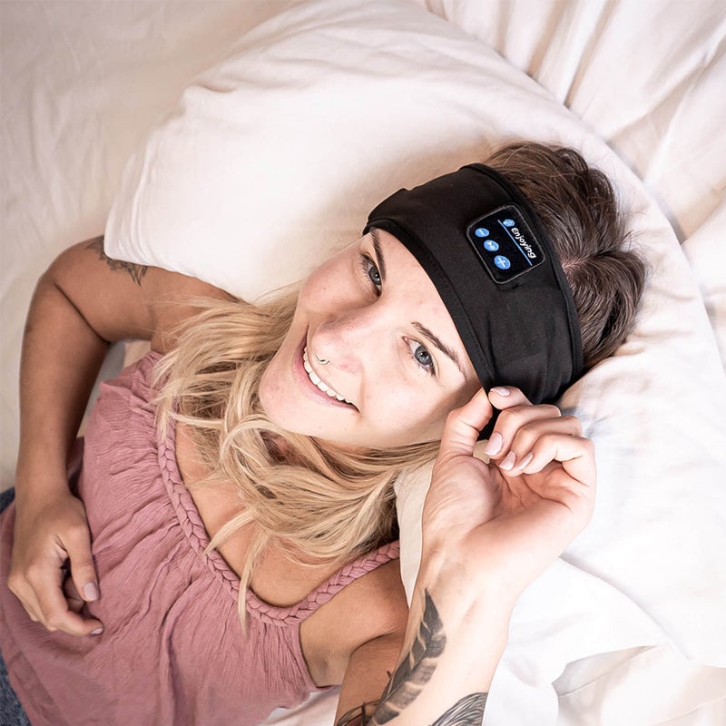 "Svart Bluetooth sportpannband med inbyggd mikrofon, trådlös teknik och flexibel passform för träning och avkoppling."