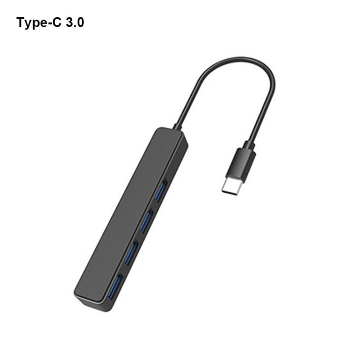 "Svart fyra-portars USB-dockningsstation med kompakt design, snabb USB 3.0-överföring, passar datorer och speltillbehör."