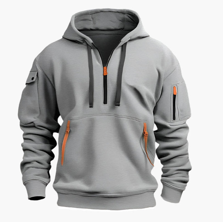 Marinblå herr hoodie med dragkedja, huva och flera fickor. Funktionell och stilren för streetwear.