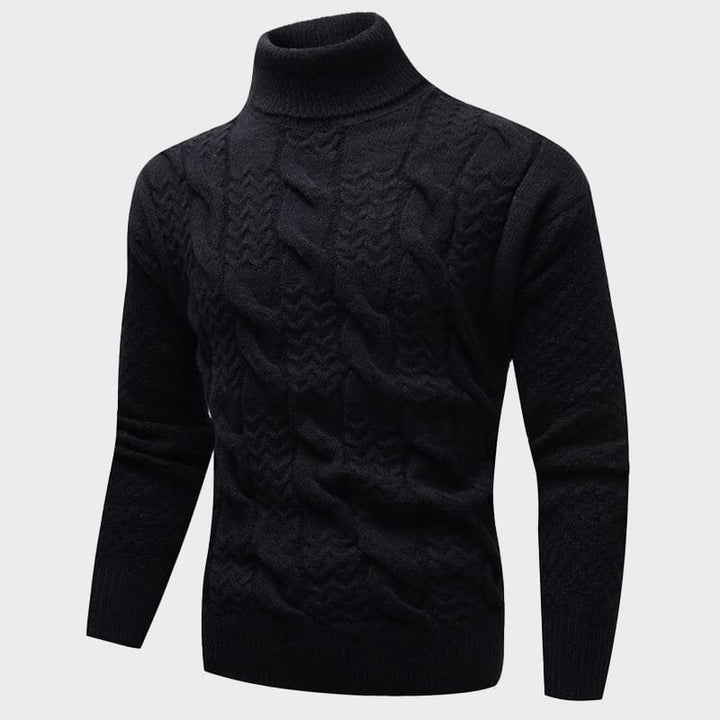 Detaljbild på mönster av en svart kabelstickad tröja med turtleneck, bekväm höstmode.