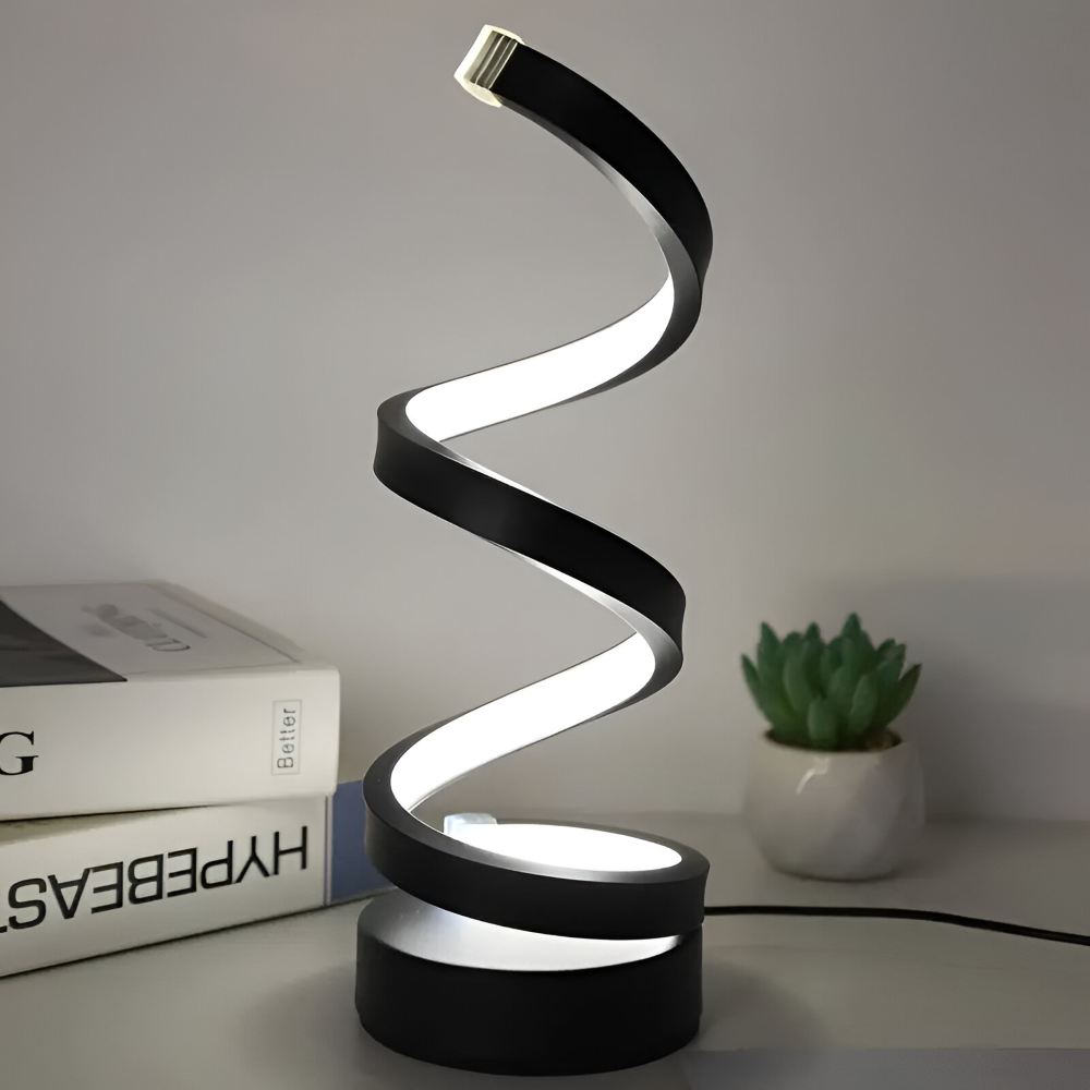 Dekorativ LED-bordslampa i svart spiraldesign, dimbar med 3 ljusfärger, passar i vardagsrum eller sovrum.