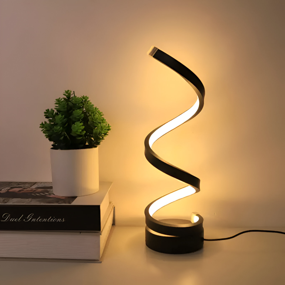 Modern dimbar bordslampa i svart med attraktiv spiraldesign. Perfekt som nattlampa eller dekorationsbelysning.