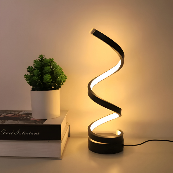 Modern dimbar bordslampa i svart med attraktiv spiraldesign. Perfekt som nattlampa eller dekorationsbelysning.