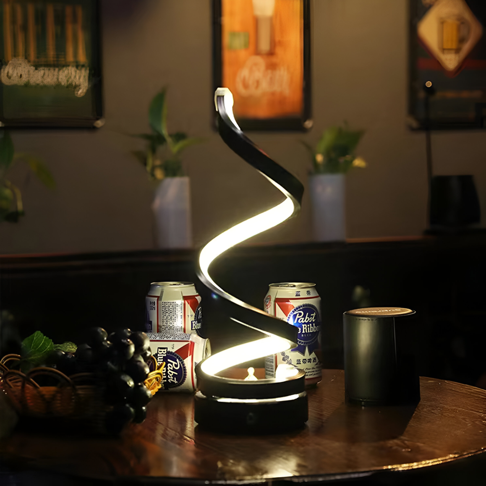 Svart bordslampa, justerbar med 3 ljusfärger och spiralformad LED-belysning, för ett samtida hem.