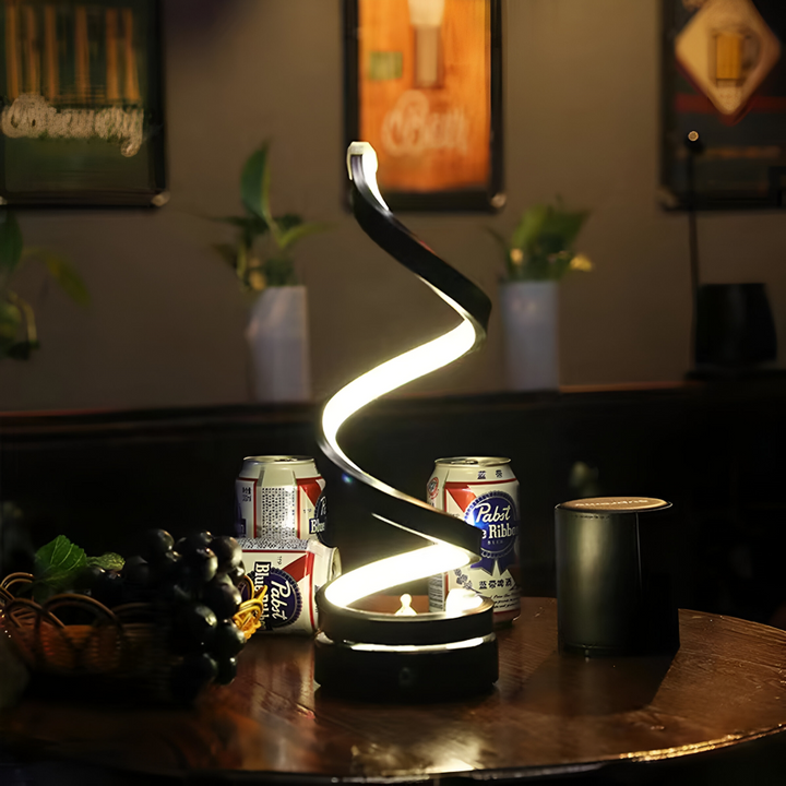 Svart bordslampa, justerbar med 3 ljusfärger och spiralformad LED-belysning, för ett samtida hem.