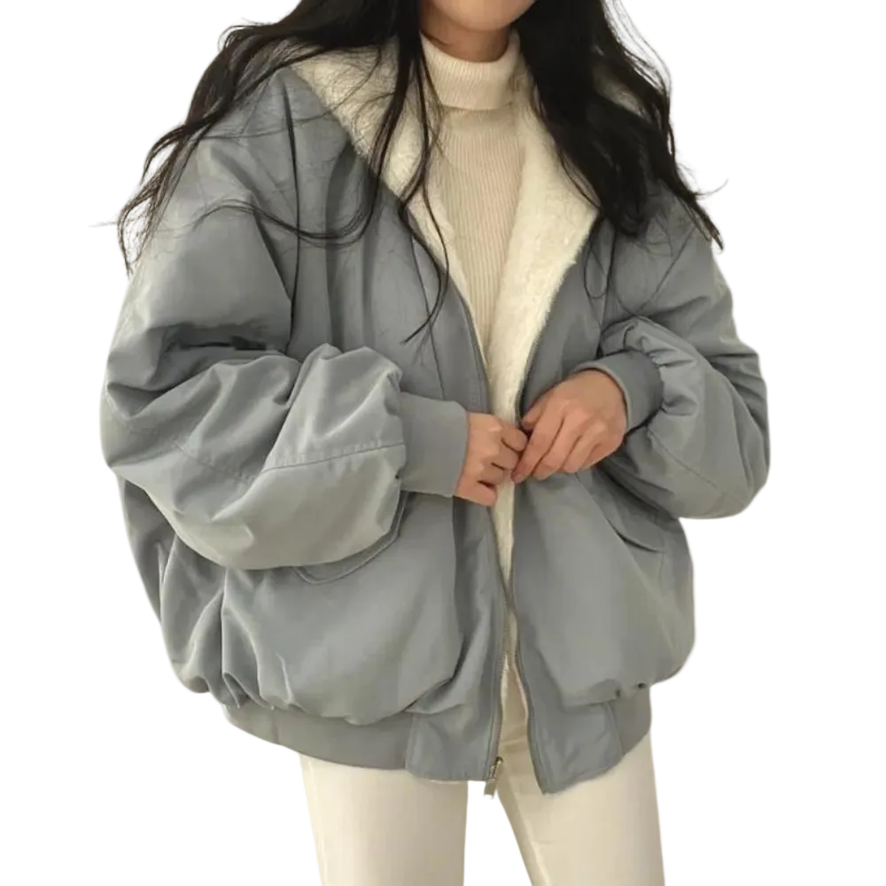 Svart oversized vinterjacka för dam, lång modell, trendig och varm för kalla dagar.