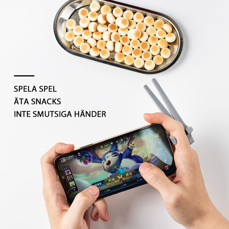 "Svart plastätpinne för snacks, innovativ design för rena händer och multitasking, perfekt för köket eller på språng."