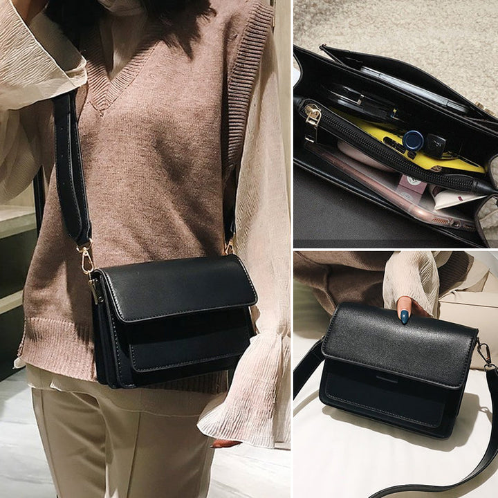 Svart retro crossbody väska i konstläder med minimalistisk design och flera fack för damaccessoarer.