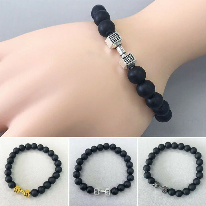 "Svart unisex hantelarmband i onyx och lavasten för chakra, elegant design, naturliga stenar, accessoar för energi och stil."