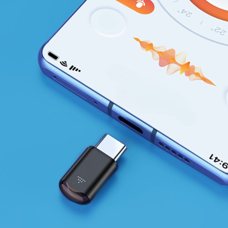 "Svart universal telefon-fjärrkontroll i PVC och aluminium för smartphones, kompatibel med Android och iOS."