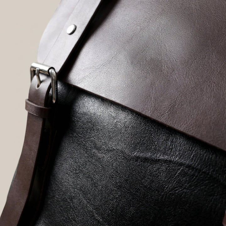 Elegant unisex läderryggsäck, vattentät. Velluno med skyddande laptopfack. Perfekt för arbetsdagar.
