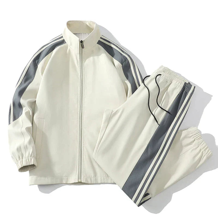 Herrars sportiga joggingset i svart och vit design med dragkedja, perfekt för aktiv fritid