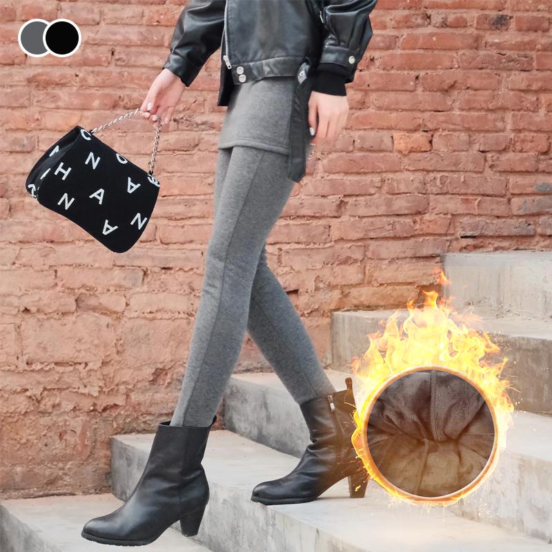 "Svarta fleecefodrade damkjolleggings, elegant och varm design, perfekt för vinterdagar, stilren matchning med stövlar."