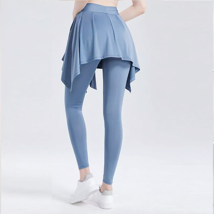 "Svarta leggings med inbyggd kjol, fyrvägsstretch och mjuk design för stilfull komfort, perfekt för modern kvinna."