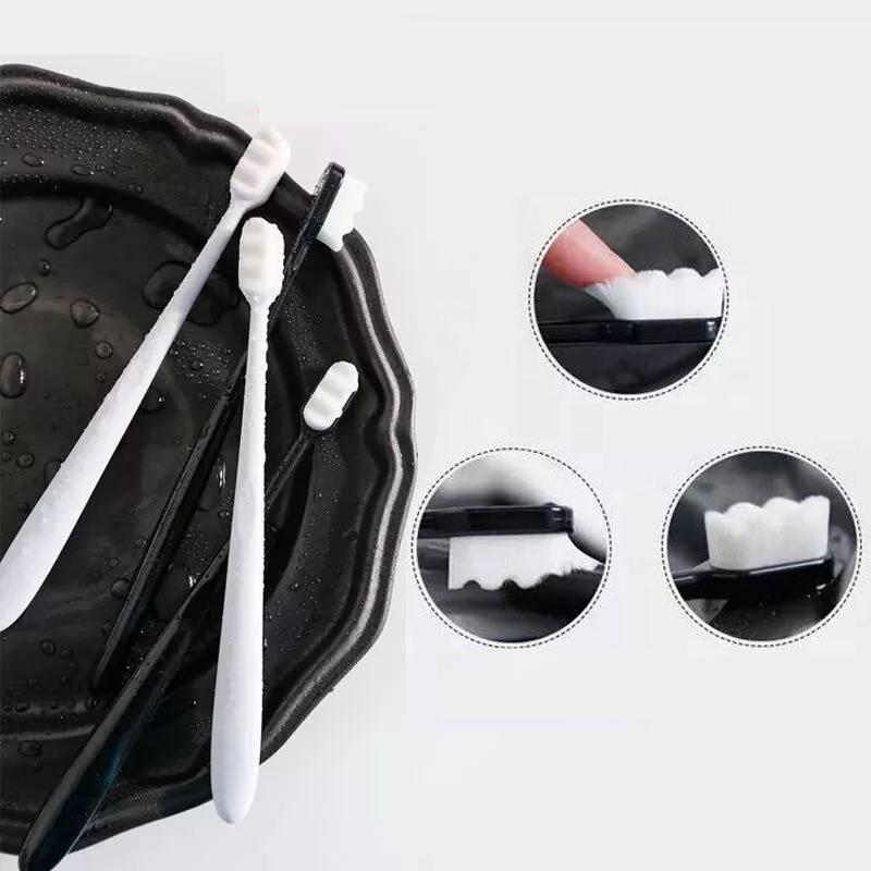 "Tandborste med 10 000 mjuka borsthår, minimal design och halkfritt ergonomiskt handtag för skonsam rengöring."