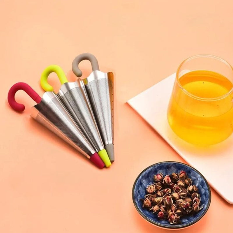 Teinfuser i paraplyform av rostfritt stål med lekfull design, i grönt, rött, grått eller blått, perfekt för tebryggning.
