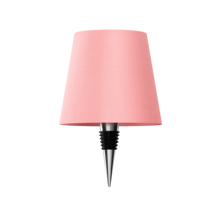 Trådlös LED flasklampa intill en växt, vacker inredningsdetalj som dekoration och mysbelysning.