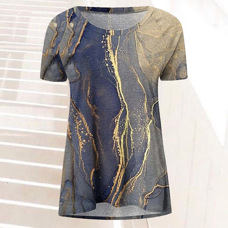 "Tryckt kortärmad dam t-shirt i bomullsblandning med vintage stil och unikt mönster i levande färger, avslappnad passform."