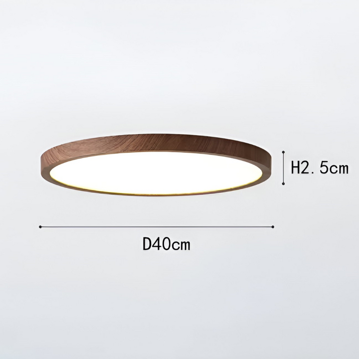 Ultratunn LED taklampa i valnötsträ som lyser upp rummet med behaglig och effektiv belysning.