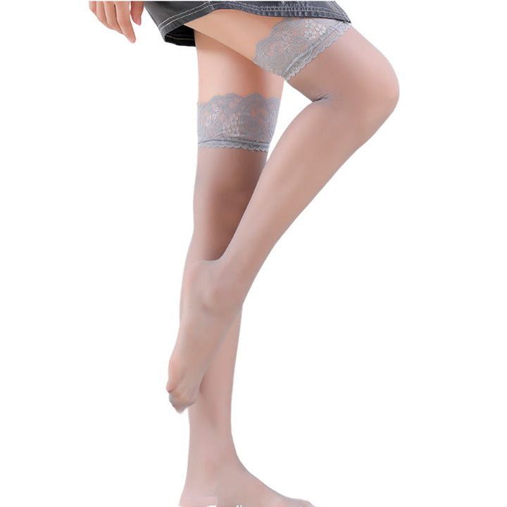 "Ultratunna svarta spetsstrumpor i bomull, elegant och funktionell design, perfekta för vinterbruk med silkeslen finish."