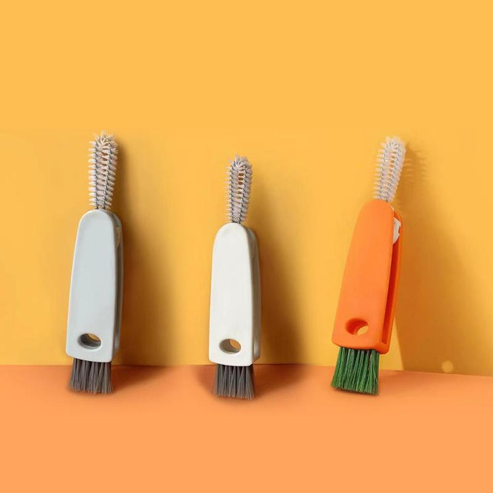 "Unisex 3-i-1 flasklockrengöringsborste för enkel rengöring, vit och orange, med smart förvaringshål och spiralborste."
