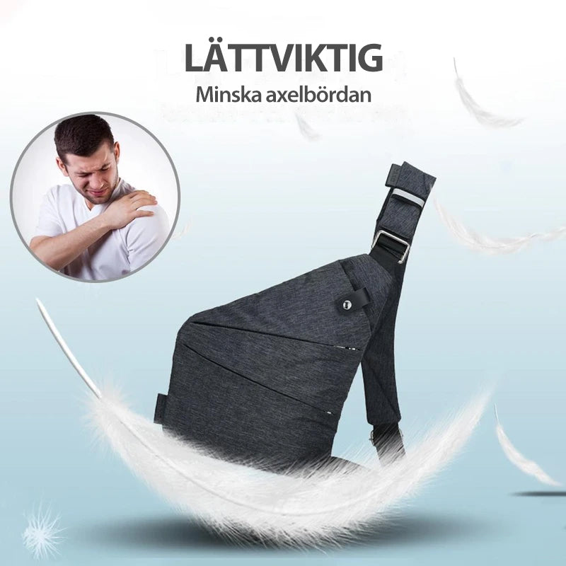 "Unisex axelväska i mörkgrå färg med justerbara remmar och flera fickor, elegant och funktionell designaccessoar."