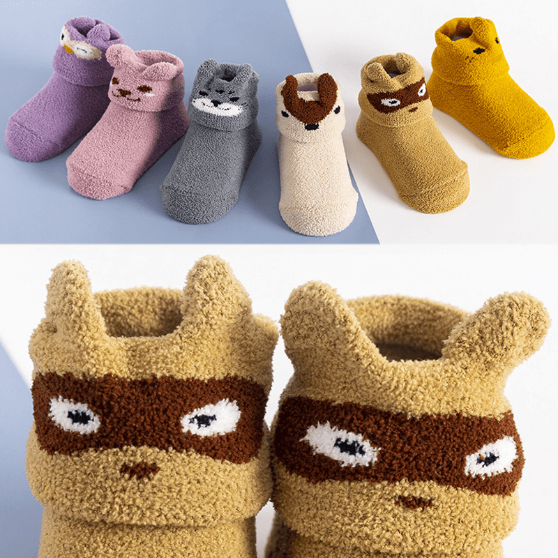 "Unisex baby anti-halk golvstrumpor med färgglada djurmotiv, perfekt för lek på trägolv och släta ytor."