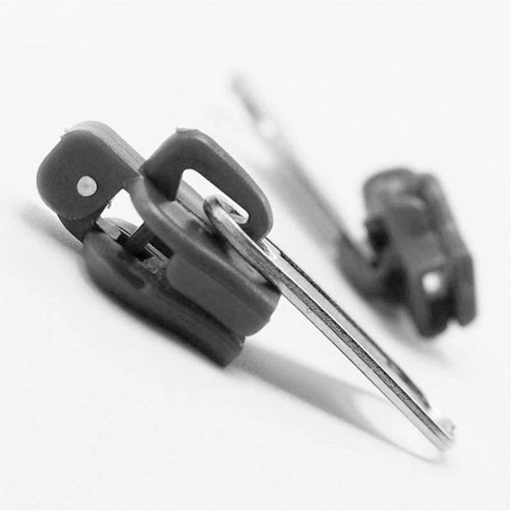 "Unisex Blixtlåsguide Fixkit med olika storlekar för reparation av dragkedjor, visas i olika nyanser och material."