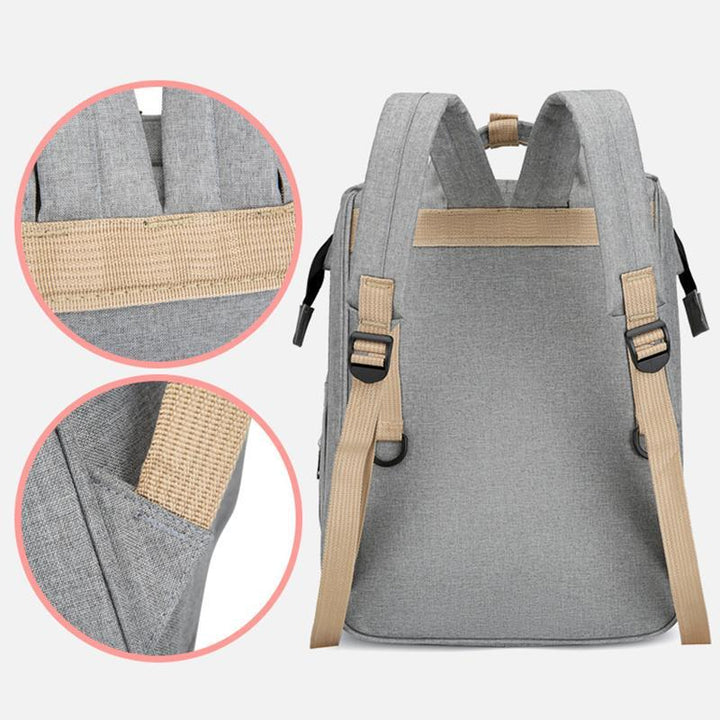 "Unisex blöja ryggsäck med inbyggt skötbord, stort förvaringsutrymme och hållbart, vattentätt Oxford-tyg."