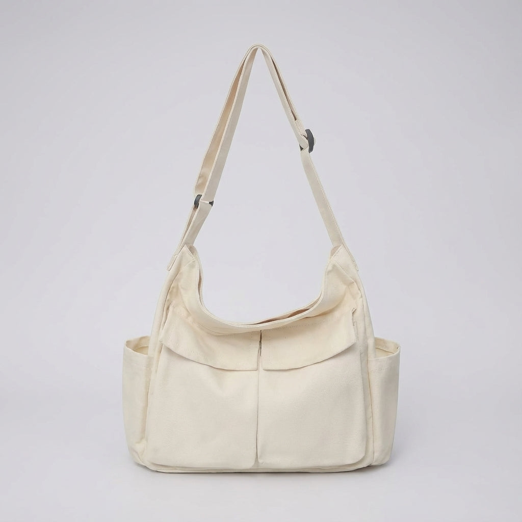 Slitstark canvas crossbody väska med säker stängning, redo för alla dina vardagsäventyr och behov.