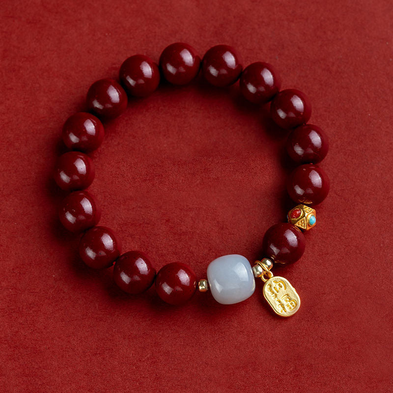 Unisex cinnabar armband i röd jasper med släta pärlor, eleganta och jordande smycken för daglig användning.