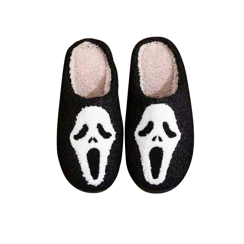 Unisex Halloween-tofflor i plysch med pumpa- och spökdesign, mysiga slip-in skor, perfekt för festlig höstkomfort.