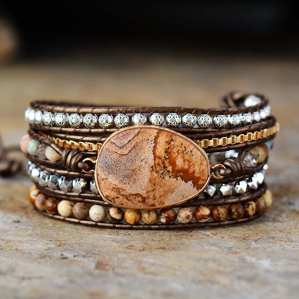 Unisex jordande armband med äkta naturstenar och läder. Handgjort lindat smycke för balans & healing.