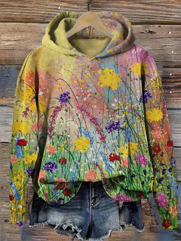 Unisex konstnärlig hoodie med levande blommönster för bekväm och avslappnad stil. Perfekt fritidsplagg.
