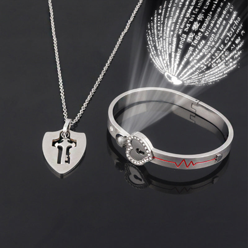 Unisex låsarmband och nyckelhalsband i titanstål, elegant design i stål och roséguld, stilfullt och hållbart smyckeset.