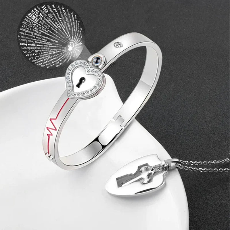 Unisex låsarmband och nyckelhalsband i titanstål, elegant design i stål och roséguld, stilfullt och hållbart smyckeset.