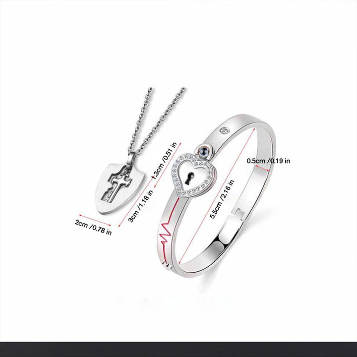 Unisex låsarmband och nyckelhalsband i titanstål, elegant design i stål och roséguld, stilfullt och hållbart smyckeset.