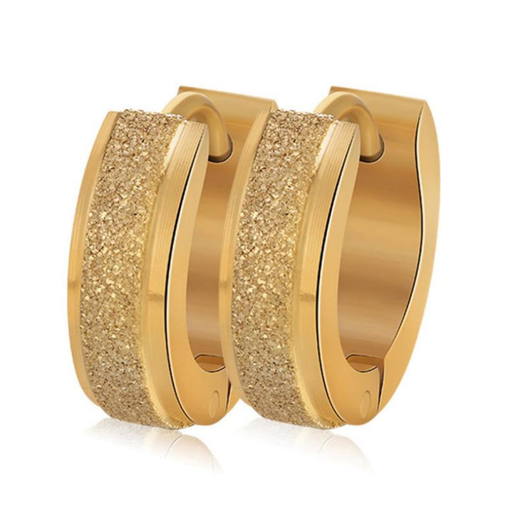 "Unisex magnetiska örhängen i rostfritt stål, elegant rund design i silver och guld, perfekt som trendig accessoar."