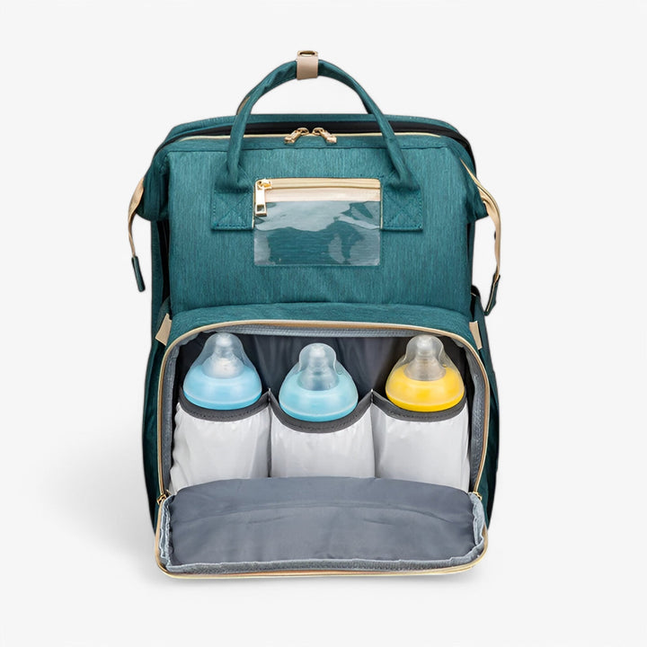 Praktisk unisex skötväska, vattenresistent, med integrerad babysäng för resan. Smart blöjväska.
