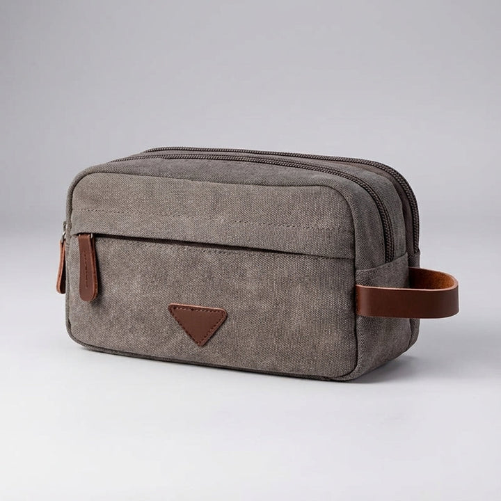 Robust canvas toalettväska, vattentät och unisex, för säker förvaring på alla resor.